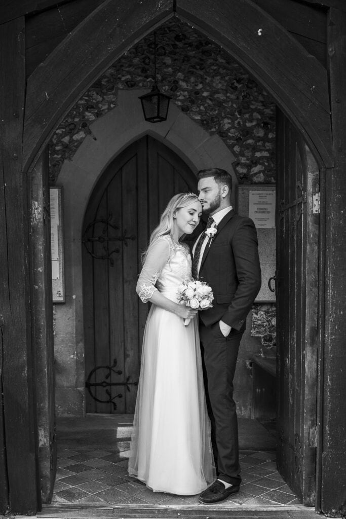 Bride and groom in church door