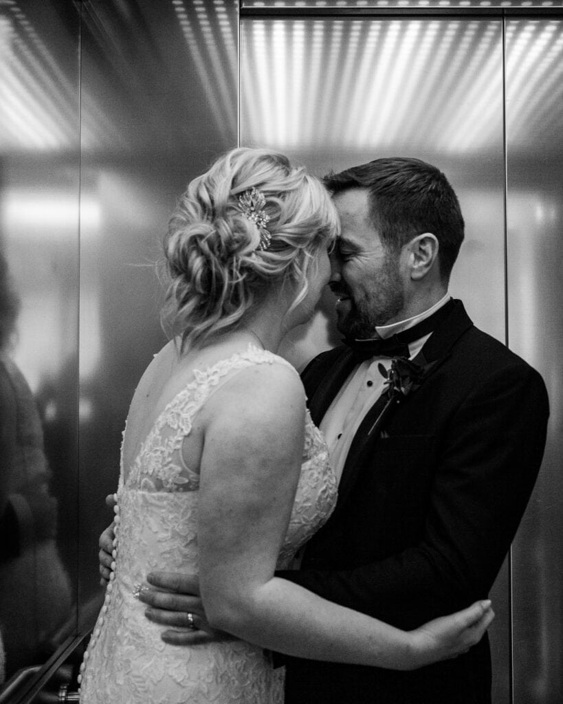Bride and groom in a lift